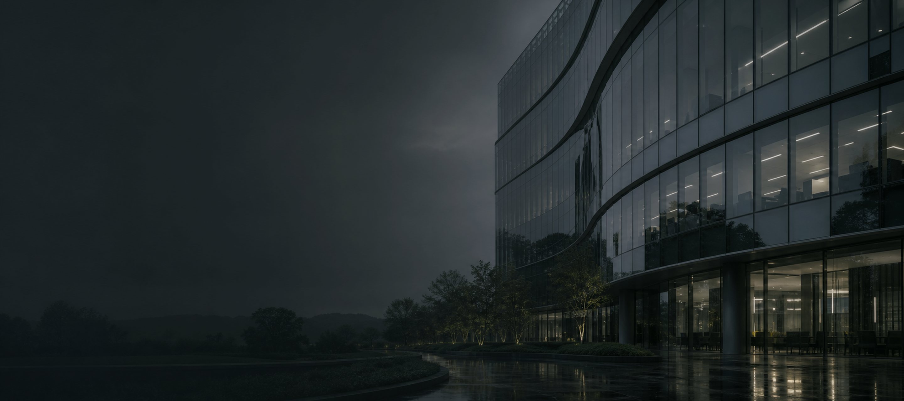 A corporate glass facade at dusk