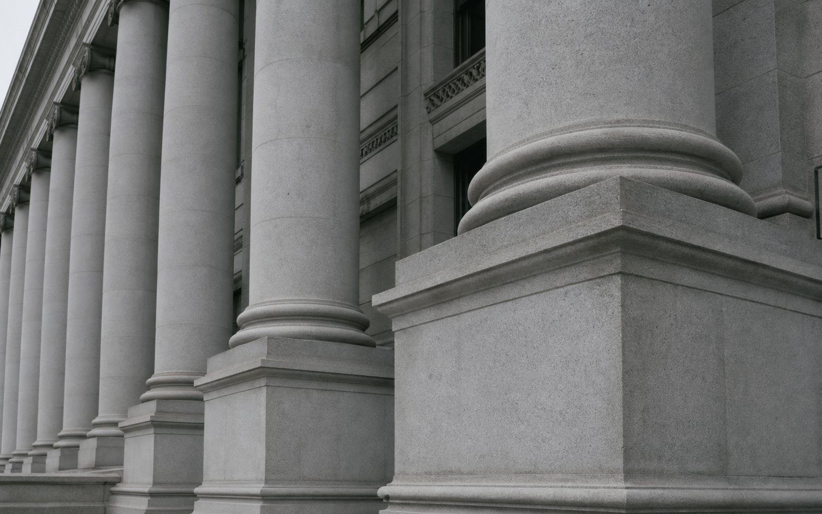 Institutional stone facade detail evoking a patent office